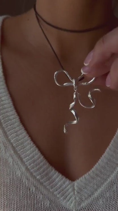 Sterling Silver 925 bow necklace on black cord